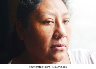 Thoughtful Native American Woman In Her 50s.