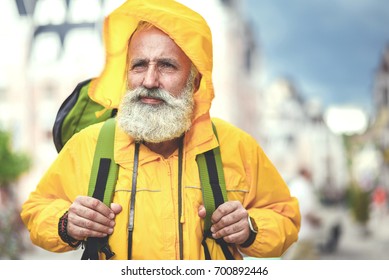 Thoughtful Old Man Traveling In City