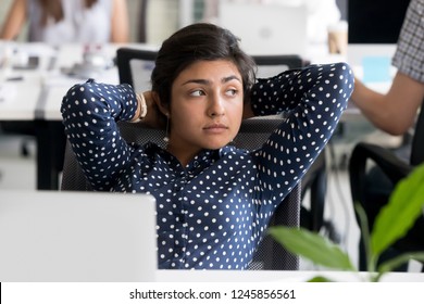 Thoughtful Peaceful Indian Female Employee Looking In Distance, Leaning Back In Chair At Workplace, Relaxing During Break After Finish Hard Job, Tired Businesswoman Thinking About Work, Feeling Bored