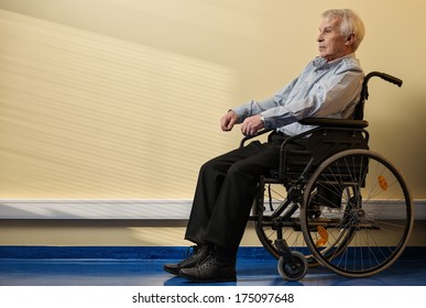 Thoughtful senior man in wheelchair in nursing home  - Powered by Shutterstock