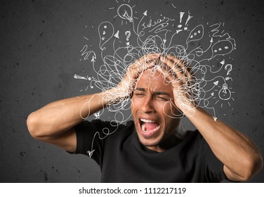 Thoughtful stressed young man with a mess - Shutterstock ID 1112217119