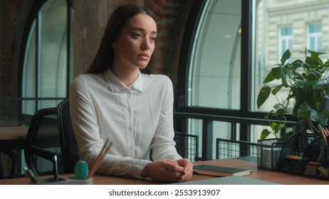 Thoughtful upset sad Caucasian girl lady businesswoman student think deep thought difficult problem thinking solution trouble unhappy worried pensive female business woman studying working in office - Powered by Shutterstock