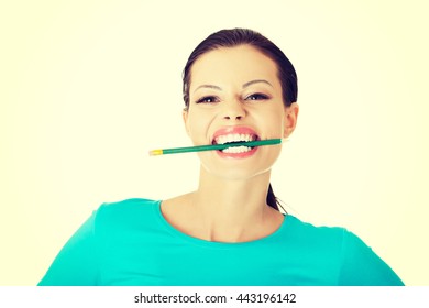 Thoughtful Woman Biting Pencil