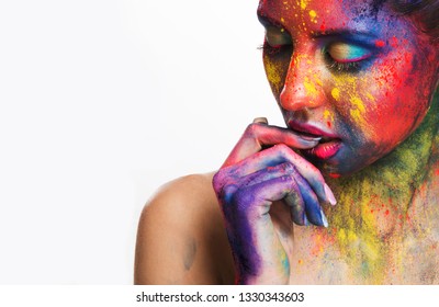 Thoughtful woman with creative colorful makeup biting her nails, white background with free space