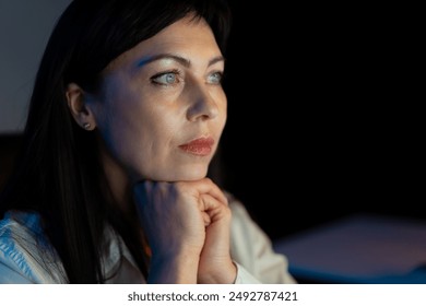 Thoughtful Woman In Deep Contemplation, Gazing With Intensity And Focus, Illuminated In Soft Light, Emitting Calm And Introspection - Powered by Shutterstock