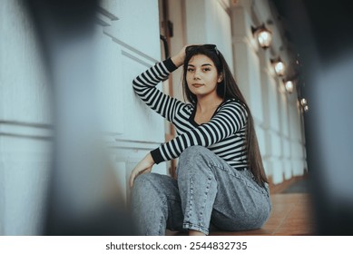 A thoughtful woman gazes out the window, capturing a quiet, reflective moment. - Powered by Shutterstock