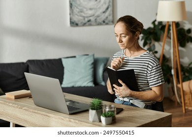 A thoughtful woman with vitiligo reflects while writing in her journal. - Powered by Shutterstock