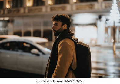 A thoughtful young adult ambles through the night in a cityscape, capturing a mood of urban isolation and contemplation. - Powered by Shutterstock