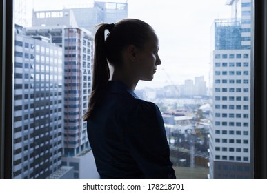 Thoughtful Young Business Woman