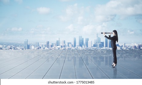 Thoughtful young businesswoman using binoculars on city background. Research and vision concept - Powered by Shutterstock