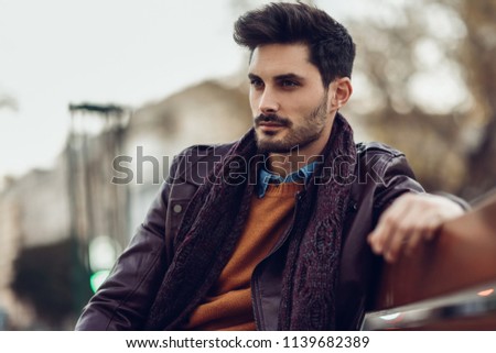 Similar – Young man wearing winter clothes in the street.