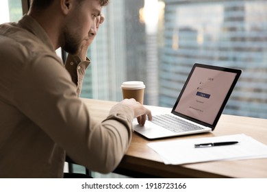 Thoughtful Young Man Worker, Student Sit By Laptop, Prepare To Input Personal Data Entering Account. Pensive Millennial Guy Creating Strong Login Password To Electronic Bank. Close Up