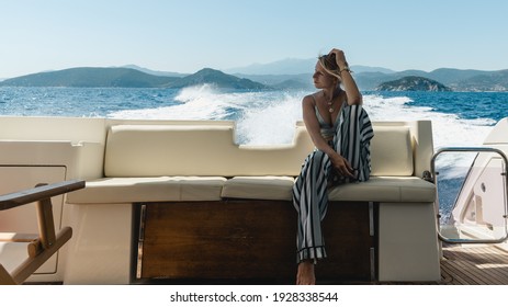 Thoughtful young woman observe beautiful sea water during cruise at yacht