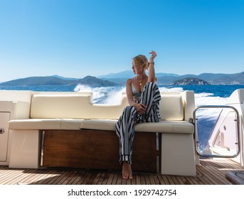 Thoughtful young woman observe beautiful sea water during cruise at yacht
