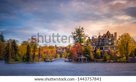 Thousand Islands.  This is at the outlet of the Lake Ontario at the head of the Saint Lawrence River. The region is bisected by the Canada–USA.