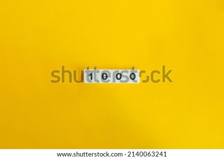 Thousand Number (1000) on Letter Tiles on Yellow Background. Minimal Aesthetics.