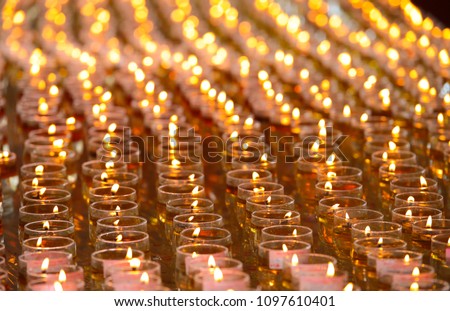 Thousand of oil lamps offering by devotees burning at Maha Vihara buddhish temple, Kuala Lumpur Malaysia, on wesak day. 
