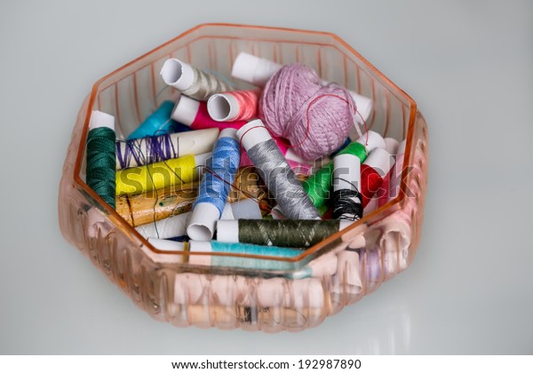 Thread and material for handicrafts in box isolated on\
white 