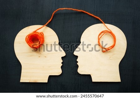 The thread rewinds from one head to another as concept of training, mentoring, psychotherapy.