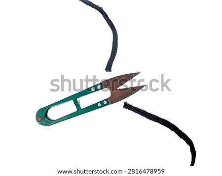 Thread Snips Cutting Black Cord On White Background