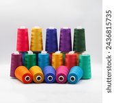 Thread spools background. Various colors sewing kit. Collection of threads. Vibrant vivid colors. Sew threads. Colorful hobby background. Tailor shop texture.