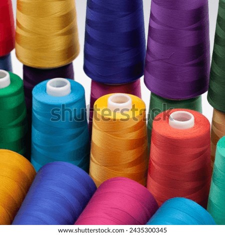 Thread spools background. Various colors sewing kit. Collection of threads. Vibrant vivid colors. Sew threads. Colorful hobby background. Tailor shop texture.