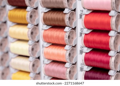 Thread spools with warm colors.