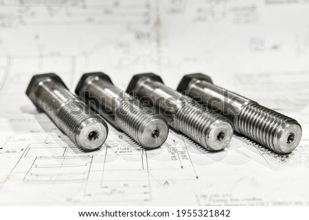 Threaded bolts in technical drawings after turning.