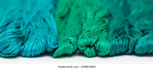 Threads of azure tints on a white canvas. - Shutterstock ID 1298874835
