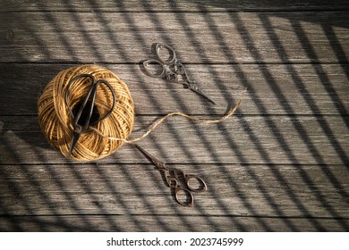 Threads and scissors on the bottom of the tree.