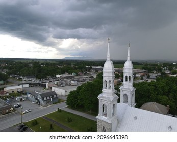 Threatening Sky Over The Steeple Of A Church In The Montérégie Region Of Quebec. The Contrast Of The Heavens.