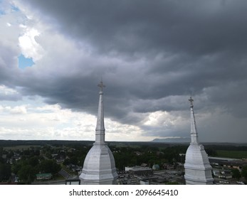 Threatening Sky Over The Steeple Of A Church In The Montérégie Region Of Quebec. The Contrast Of The Heavens.