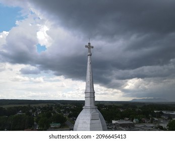 Threatening Sky Over The Steeple Of A Church In The Montérégie Region Of Quebec. The Contrast Of The Heavens.