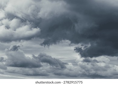 Threatening storm sky. Dramatic dark gray clouds background photo.