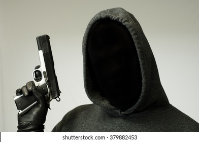 Threatening thug holds a gun