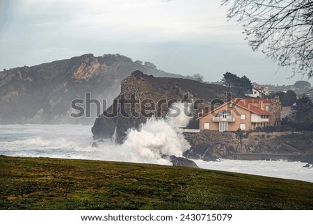 threatening waves from the Cantabrian Sea, with rough seas that threaten the houses of the village by breaking on the cliffs.