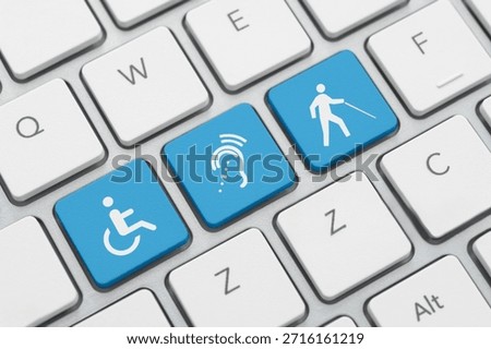 Three accessibility icon on computer keyboard
