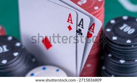 Three aces among the playing chips on the poker table. The concept of playing poker, gambling. High quality photo