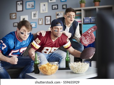 Three Adult Guys In Anticipation Of Next Score