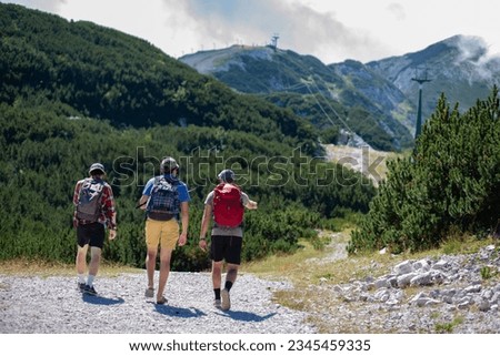 The three adventurous individuals exploring a nature trail in Triglav National Park, Slovenia