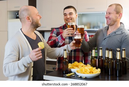  Three American Men Drinking Beer And Laughing At House Party