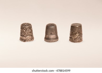 Three antique silver thimbles