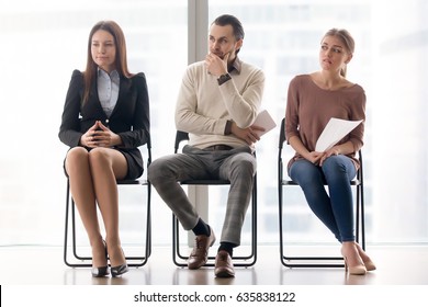 Three Applicants Making Preparations For Job Interview, Audition Result Awaiting, Feeling Worried And Stressed, Sitting In Waiting Room, Suffer From Lack Of Self-confidence, Tension Is In The Air