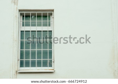 Three Arched Windows with Iron Bars