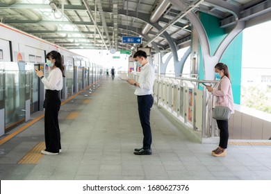 Three Asian people wearing mask standing distance of 1 meter from other people keep distance protect from COVID-19 viruses and people social distancing  for infection risk 