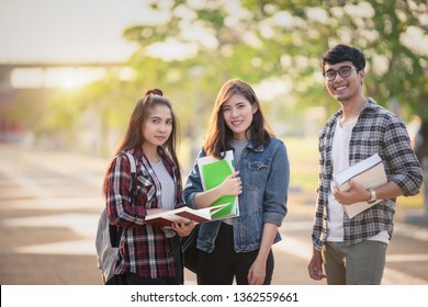 Three Asian Peoples Portrait, Scholarship Students Smile And Fun In Park At University. Life Of Studying And Friendship, Overseas Students Concept.