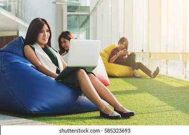 Three Asian Teenagers Using Technology By The Windows, Internet Of Things (iot) Conceptual