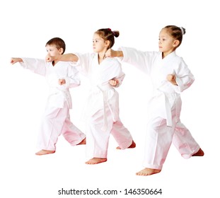 Three athletes in a kimono on a white background beat punch arm