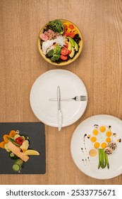 three balanced and nutritious meals breakfast, lunch, and dinner plate and utensils arranged like a clock, symbolizing meal times themes of healthy eating, wellness, and time management in nutrition