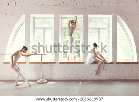 Three ballet dancers posing across arched windows in sunlit studio. Concept of dance school advertising, artistic portraiture, graceful teamwork in performing arts culture.